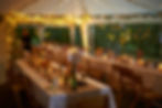 Decorated wedding venue tables with wine